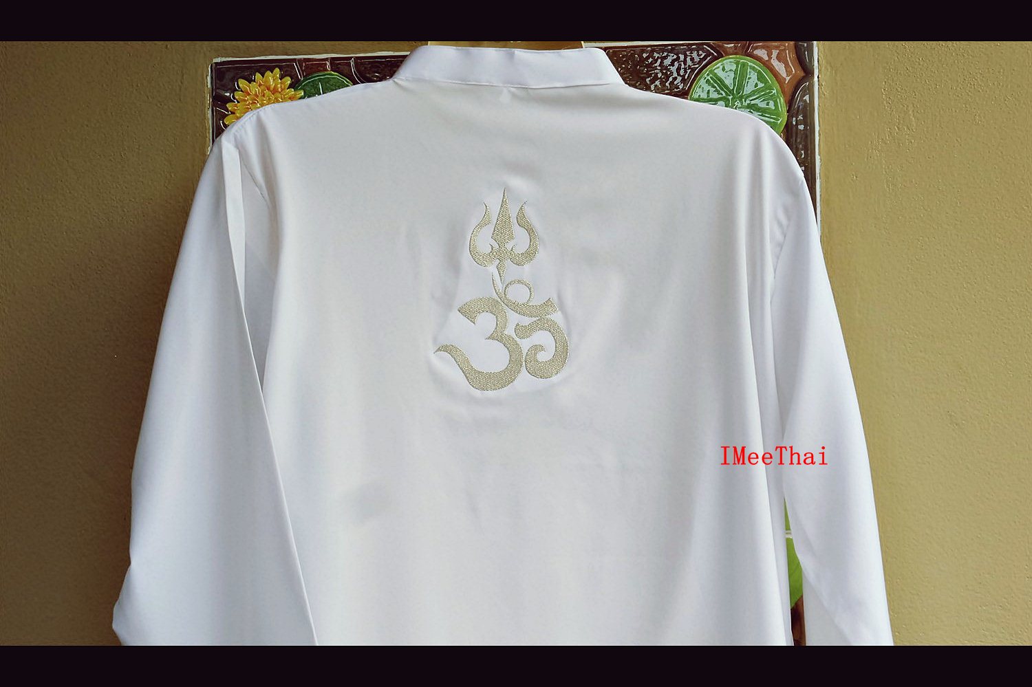 เสื้อขาว โอม พระพิฆเนศ ตรีศูล อักษรสีเงิน