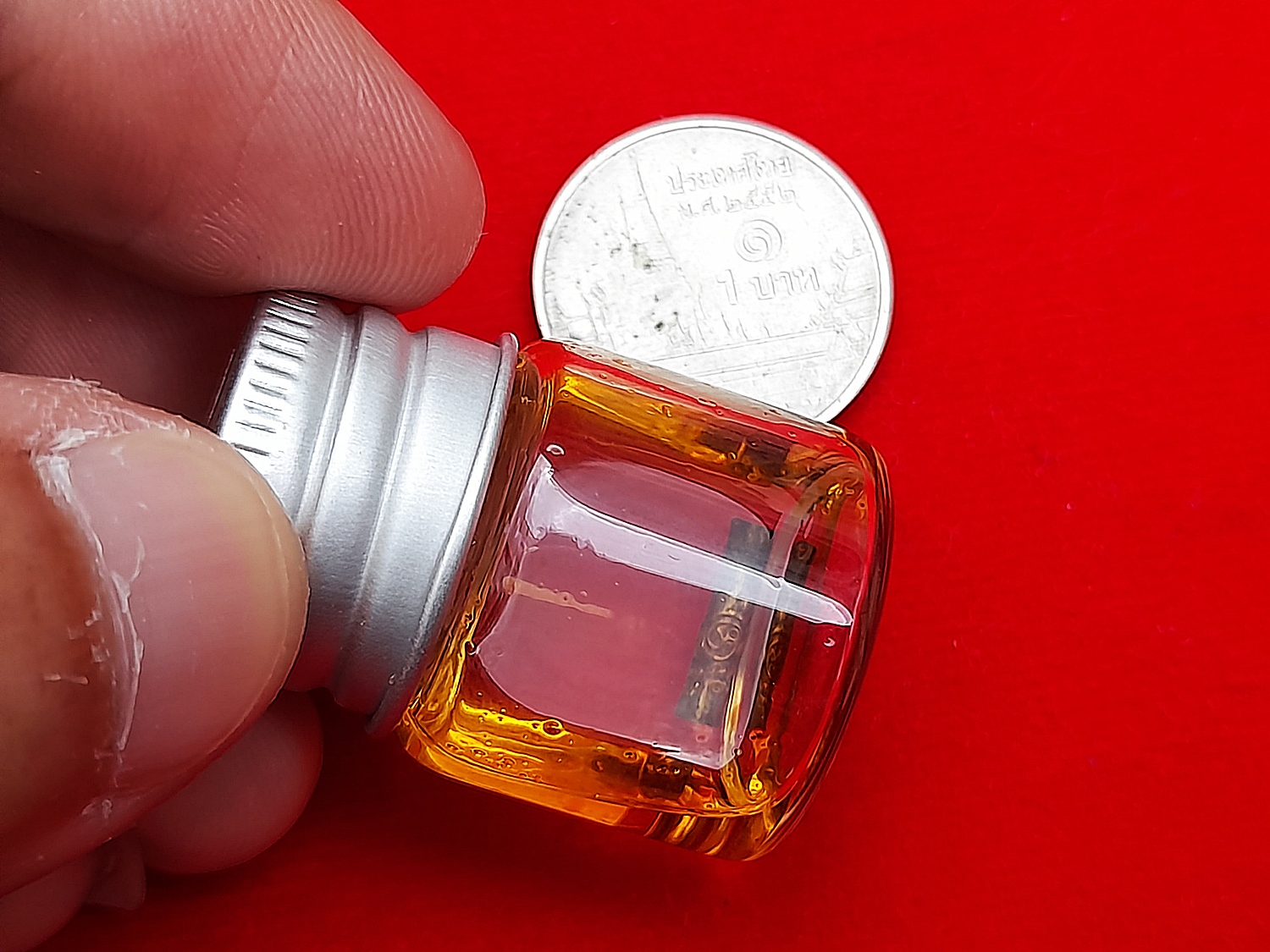 ตะกรุดยันต์นะเศรษฐี(มหาลาภ)(ตำหรับหลวงพ่อกวย วัดโฆสิตาราม) ดอกเล็ก เนื้อทองเหลือง แช่น้ำมันจันทร์ ปี2564