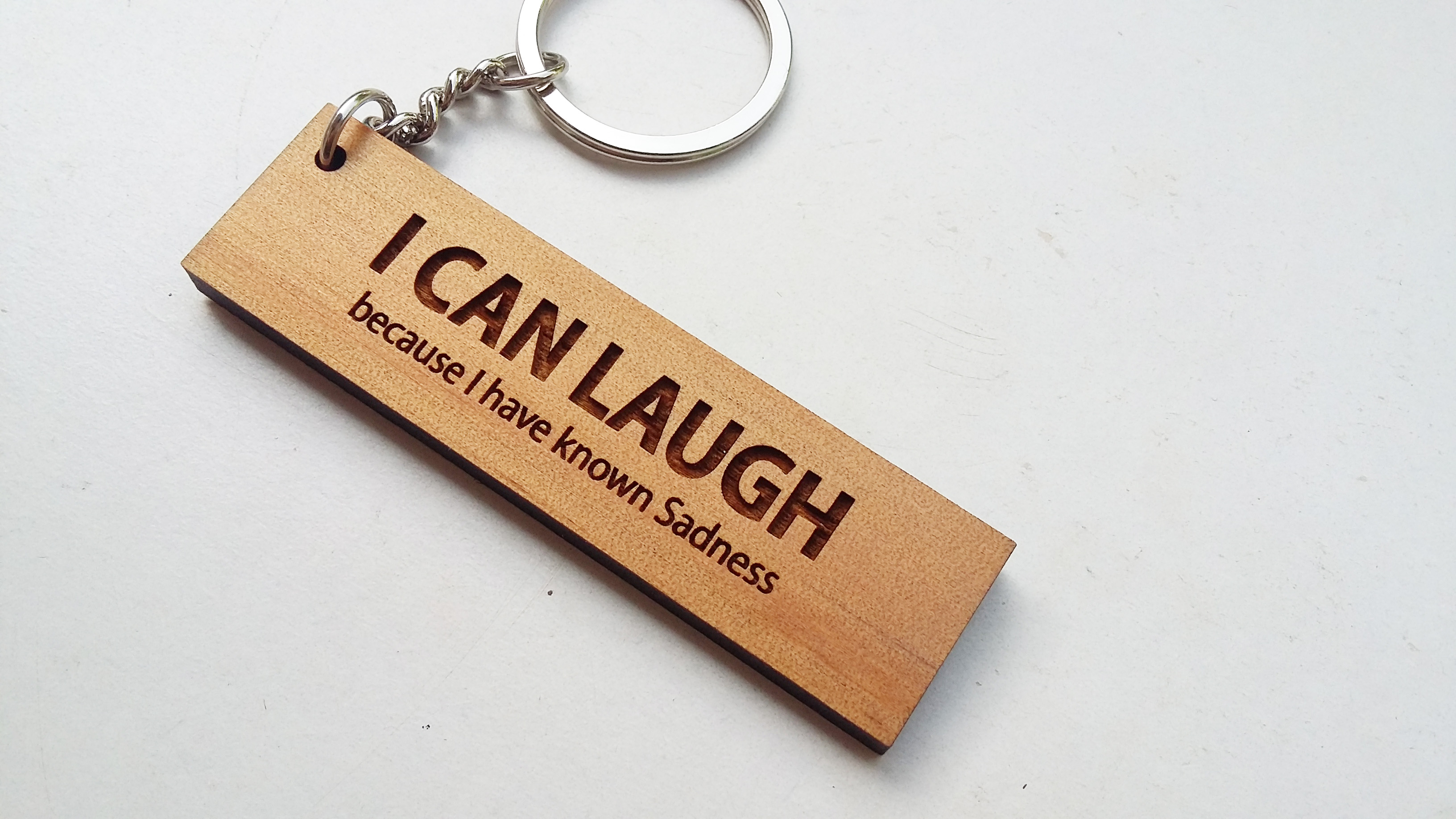 พวงกุญแจไม้ พวงกุญแจไม้ใส่ข้อความ - I CAN LAUGH because I have known sadness