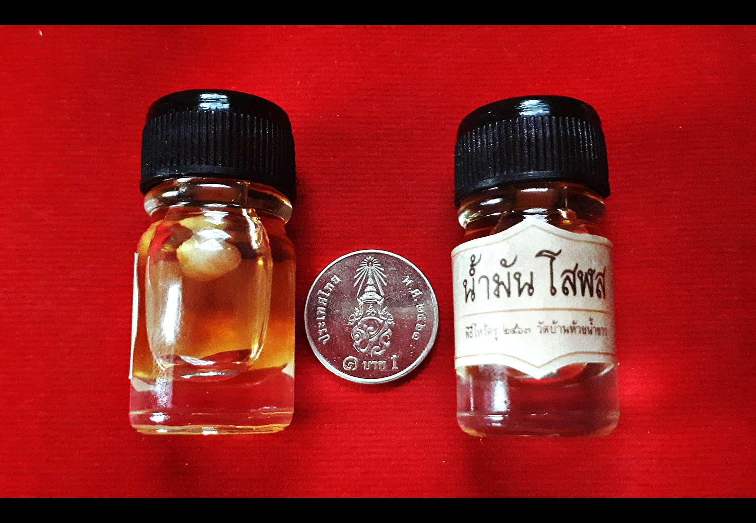 น้ำมันโสฬส (ในขวดแช่บรรจุ ลูกอมเทียนชัย) #รับประกันแท้ - หลวงพ่อเล็ก วัดท่าขนุน (ปลุกเสก ปี2563 ณ วัดห้วยน้ำขาว)