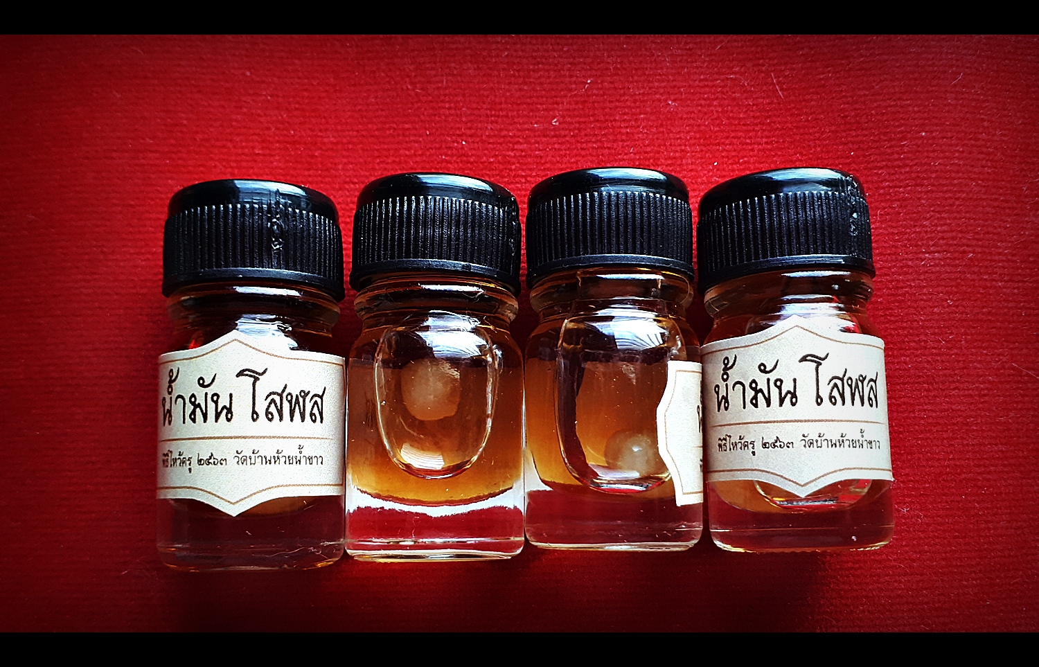 น้ำมันโสฬส (ในขวดแช่บรรจุ ลูกอมเทียนชัย) #รับประกันแท้ - หลวงพ่อเล็ก วัดท่าขนุน (ปลุกเสก ปี2563 ณ วัดห้วยน้ำขาว)
