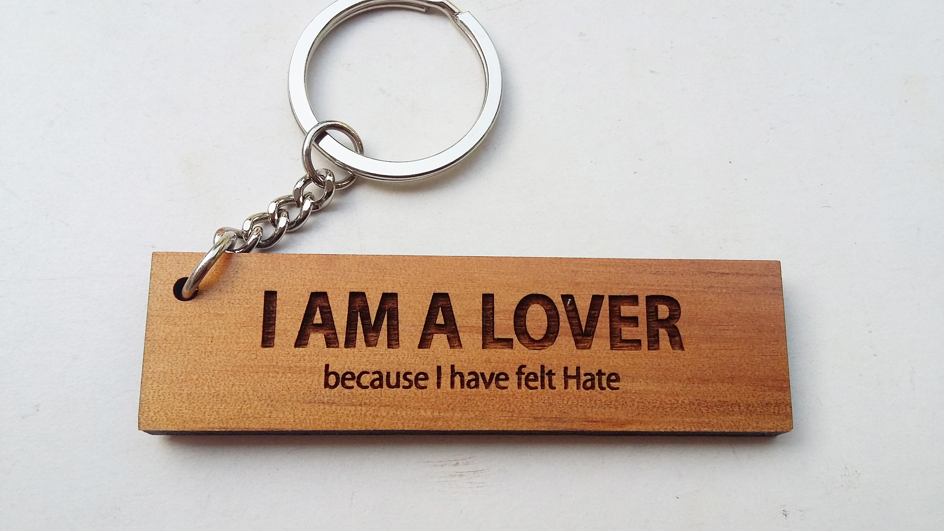 พวงกุญแจไม้ พวงกุญแจไม้ใส่ข้อความ - I AM A LOVER because I have felt hate