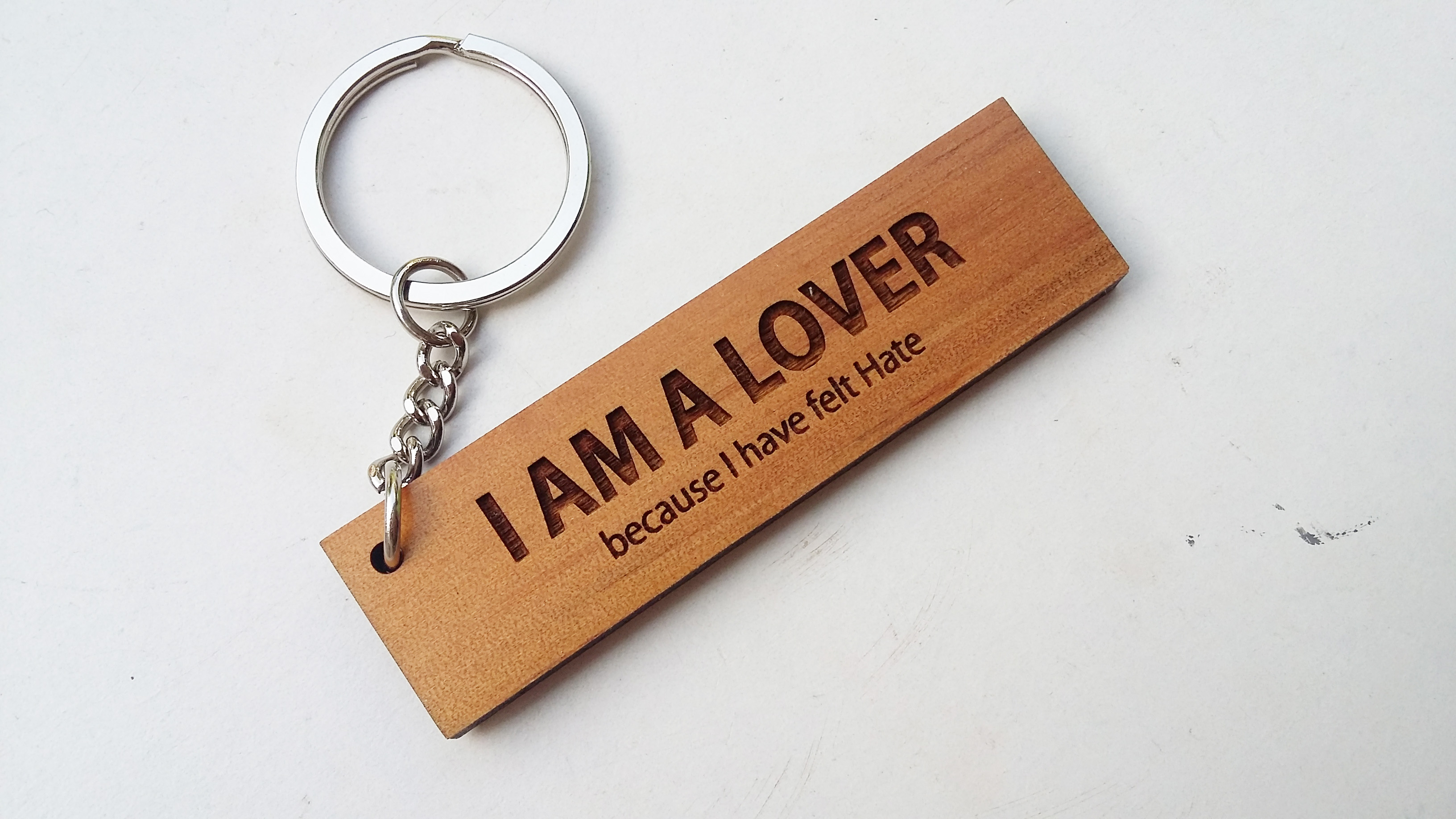 พวงกุญแจไม้ พวงกุญแจไม้ใส่ข้อความ - I AM A LOVER because I have felt hate
