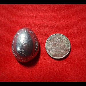 เบี้ยแก้ (เบี้ยหุ้มด้วยแผ่นตะกั่วจารเขียนอักขระด้วยมือท่านเอง) - หลวงพ่อตี๋ วัดหูช้าง (ตอกโค๊ต ต.ใบโพ และ โชคดี)