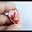เหรียญหลวงพ่อทอง วัดเขาตะเครา (ทรงหัวใจ) เนื้อกระไหล่ทอง ลงยาสีแดง ปี2557
