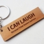 พวงกุญแจไม้ พวงกุญแจไม้ใส่ข้อความ - I CAN LAUGH because I have known sadness