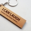 พวงกุญแจไม้ พวงกุญแจไม้ใส่ข้อความ - I CAN LAUGH because I have known sadness